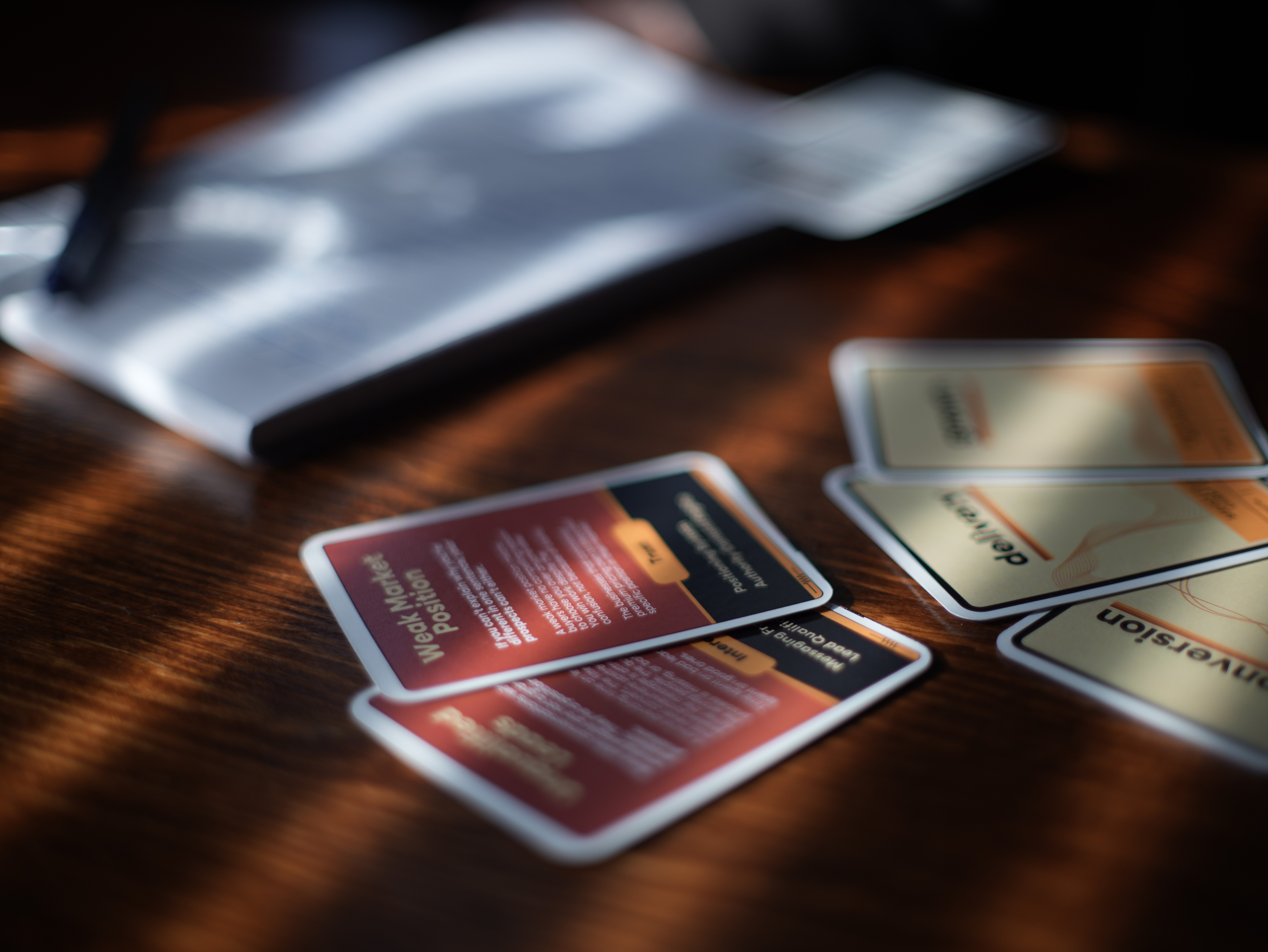 The AMP Deck cards on table during a strategy session